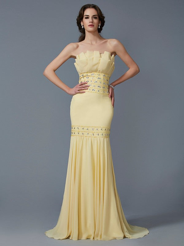 A slim fitting beautiful and elegant mermaid sleeveless beaded long chiffon dress