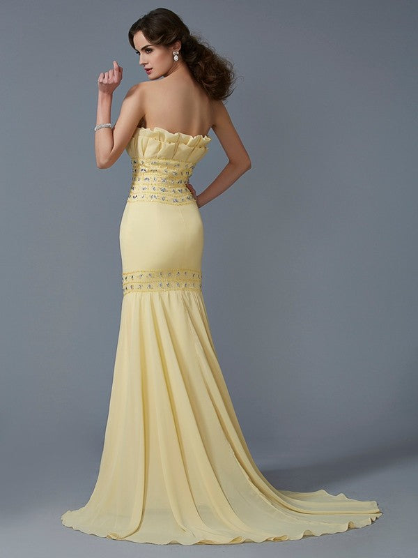 A slim fitting beautiful and elegant mermaid sleeveless beaded long chiffon dress