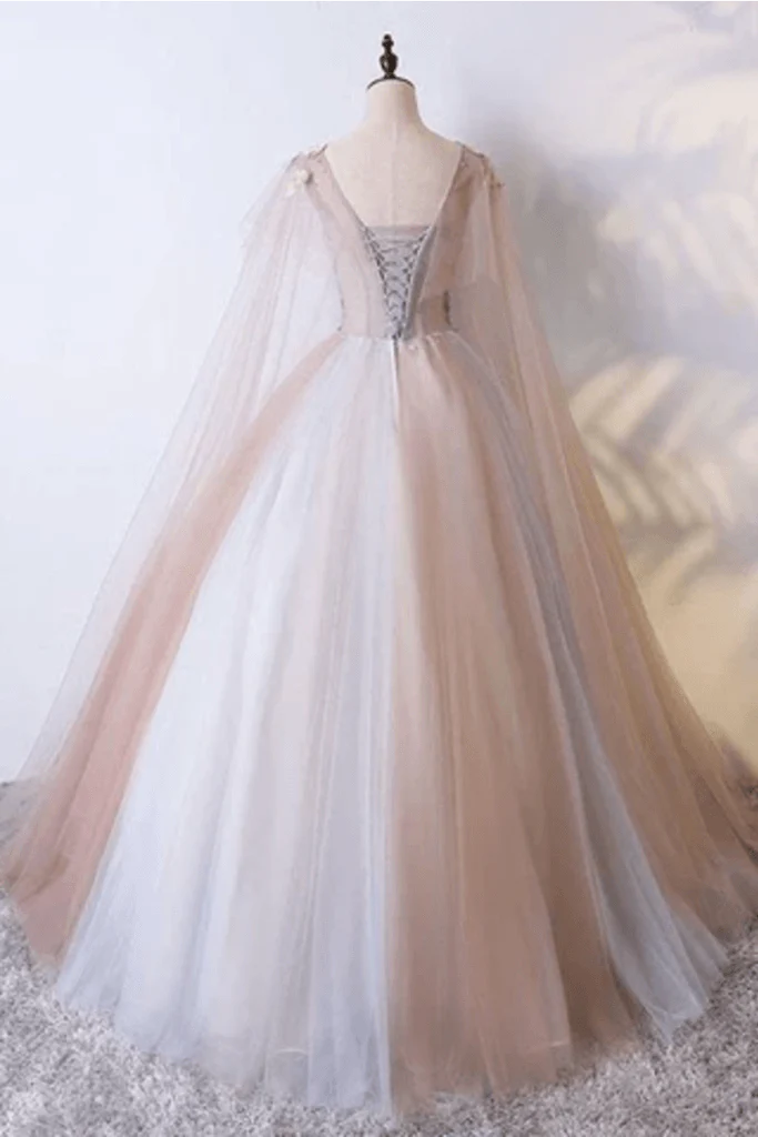 V-neck sheer ball dress with unique embellishments and floor sweeping one-fifth dress
