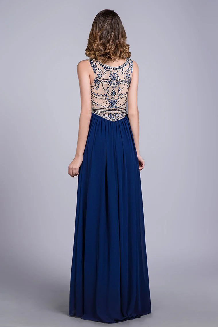 Formal low waisted A-line full-length beaded sheer tight fitting corset paired with chiffon skirt