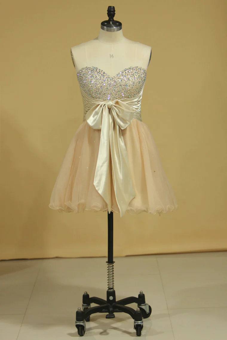 A-line short mini sweetheart with beads and bow dress