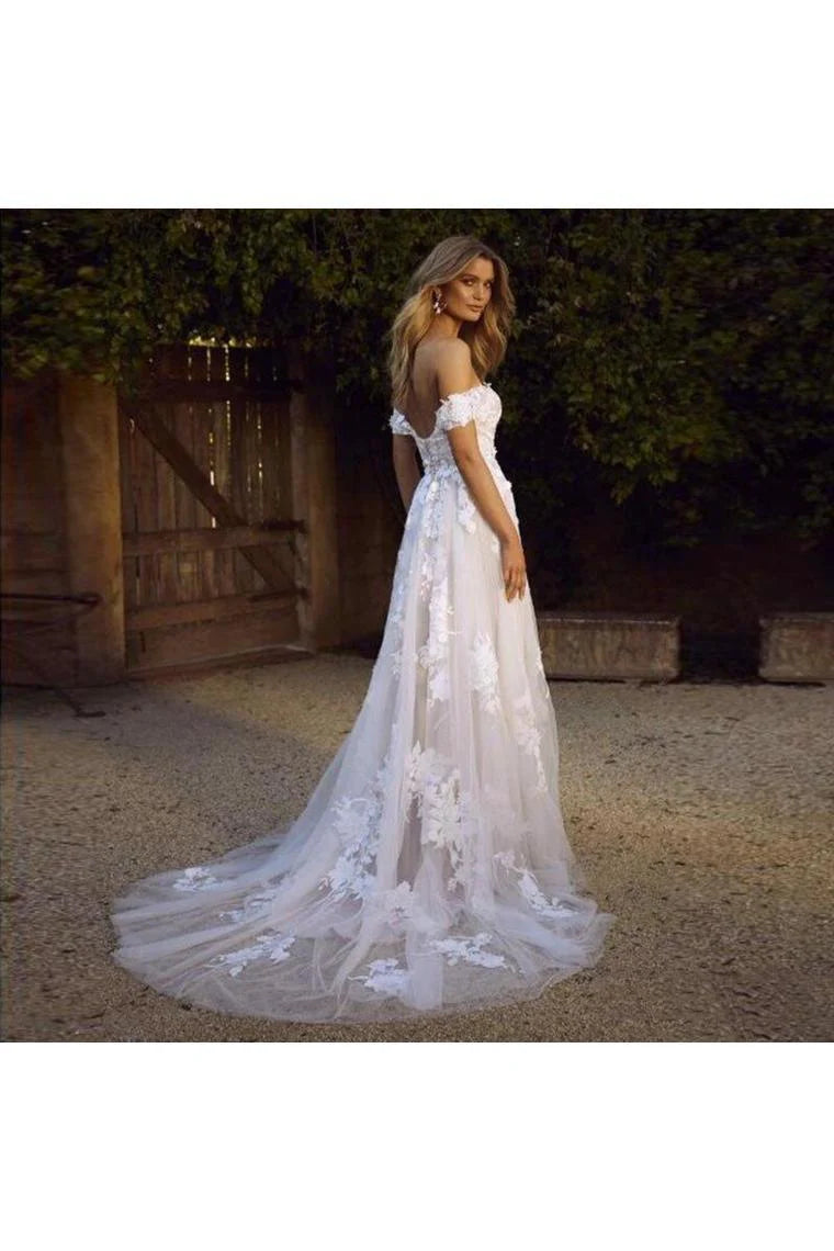 A simple and elegant A-line off shoulder white sheer beach wedding dress with stickers