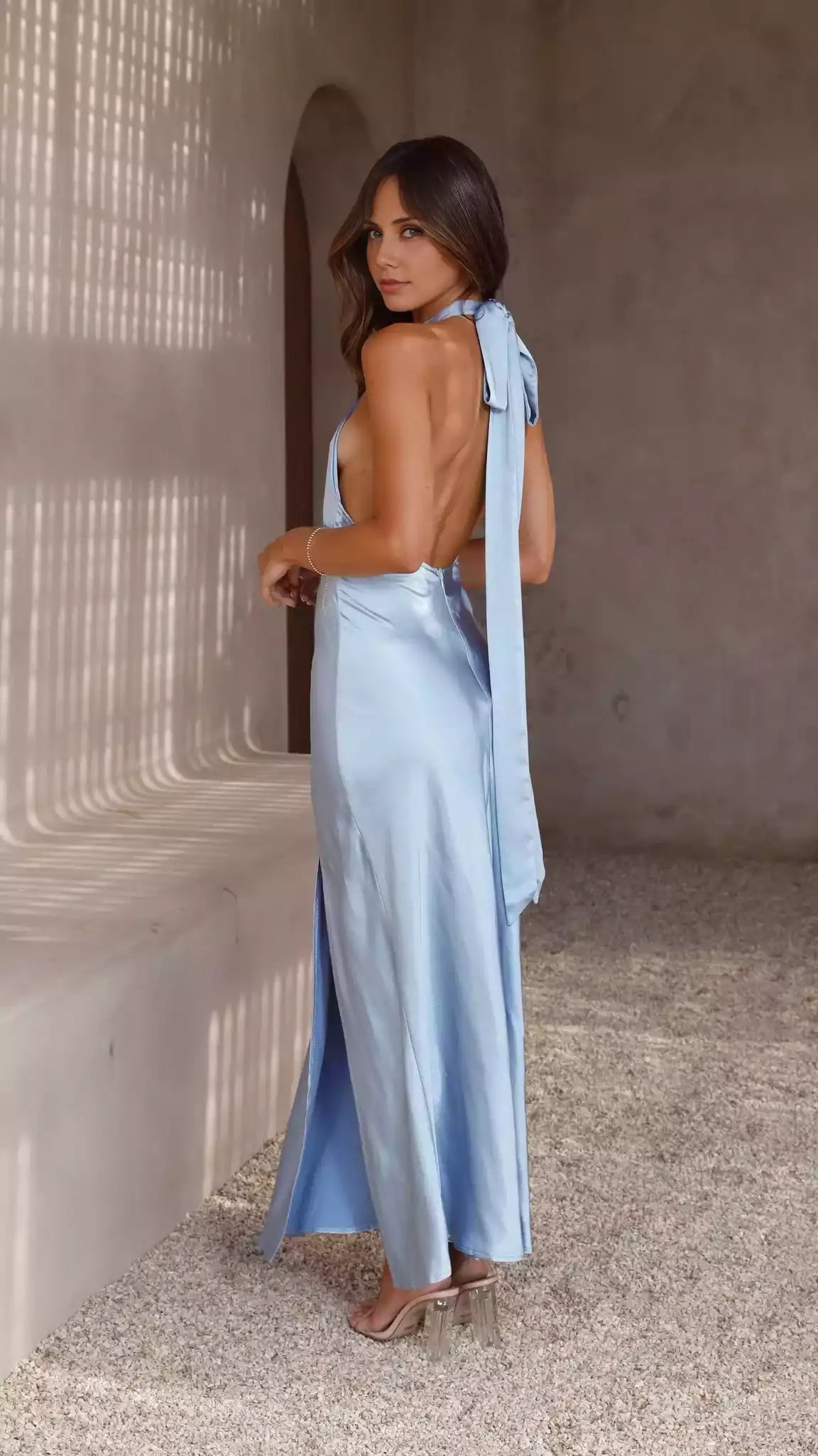 Stunning backless neckline with hollowed out adjustable neck strap, side slits, and hidden back zipper Prom Dresses