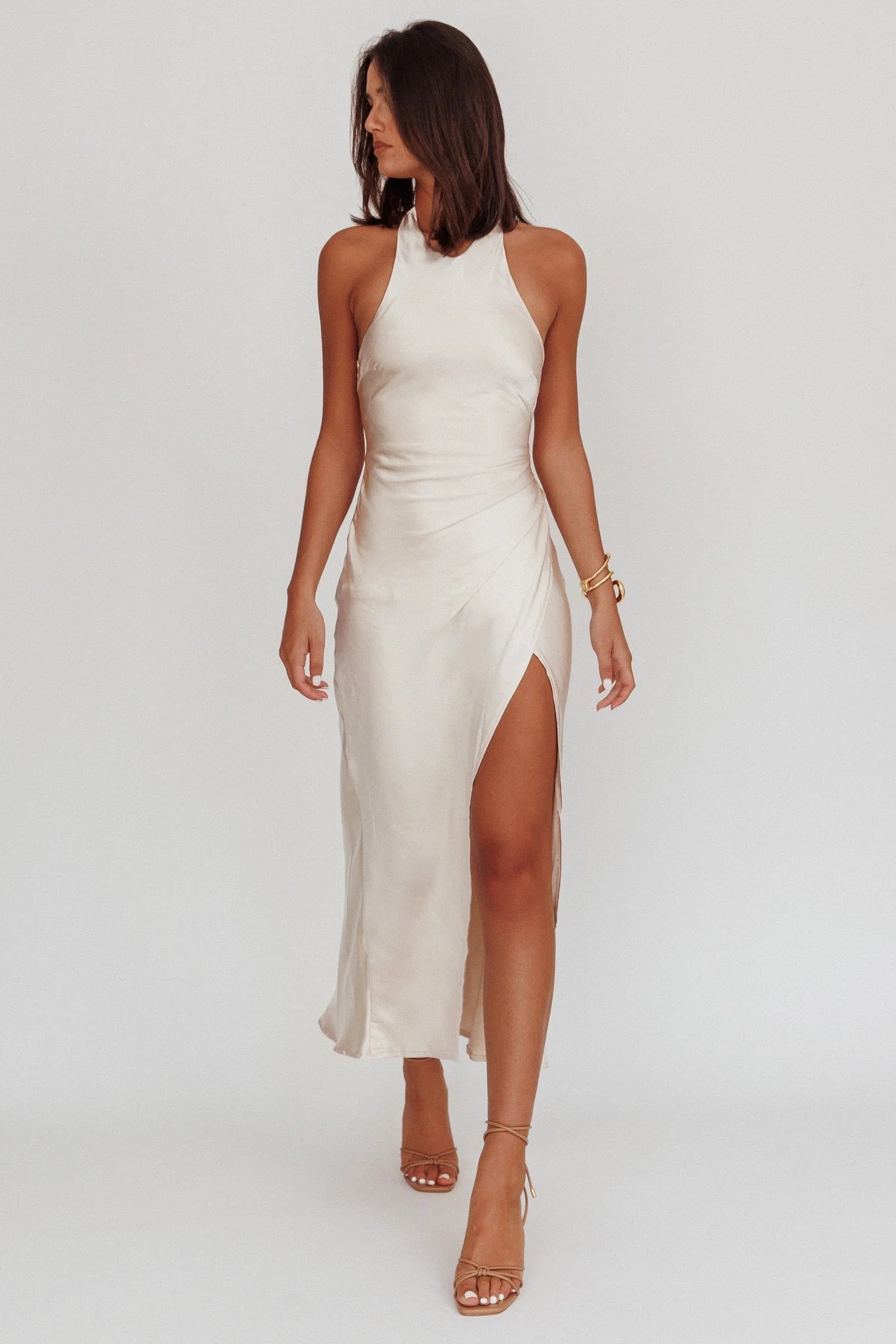 The eye-catching satin hanging neck, long leg slit, backless twisted bridesmaid dress