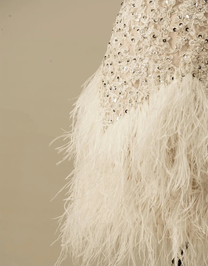 Gorgeous and elegant white spaghetti strap adorned with feathers in the back to school dress