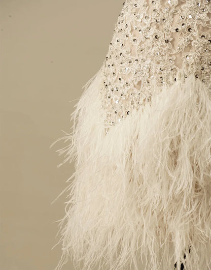 Gorgeous and elegant white spaghetti strap adorned with feathers in the back to school dress