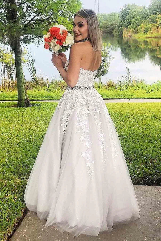 A charming high necked dance dress with a long lace formal dress