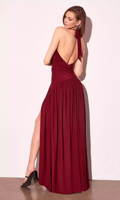 Elegant backless camisole with pleats, low V-neck, camisole style neckline, and side slits add a fashionable touch to Prom Dresses
