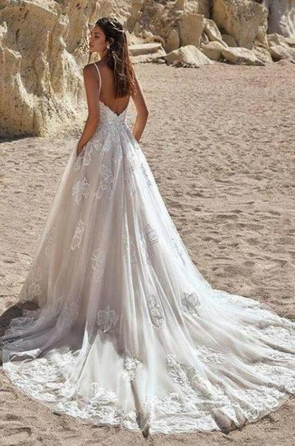 Ivory colored spaghetti length A-line bridal gown