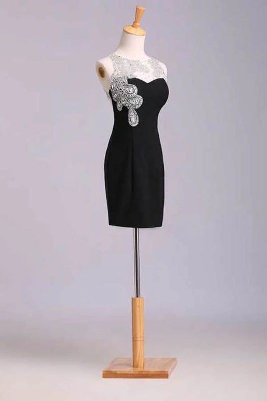The short mini dress is adorned with chiffon beads and chiffon beads