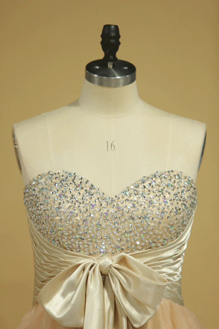 A-line short mini sweetheart with beads and bow dress
