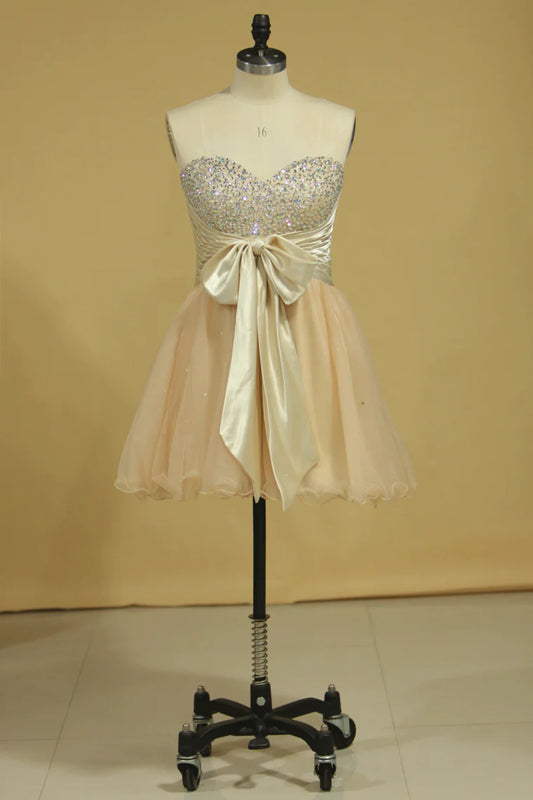 A-line short mini sweetheart with beads and bow dress