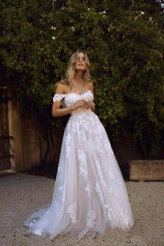 A simple and elegant A-line off shoulder white sheer beach wedding dress with stickers