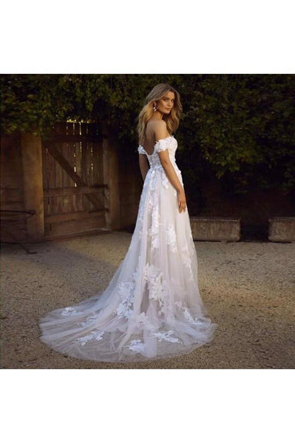 A simple and elegant A-line off shoulder white sheer beach wedding dress with stickers