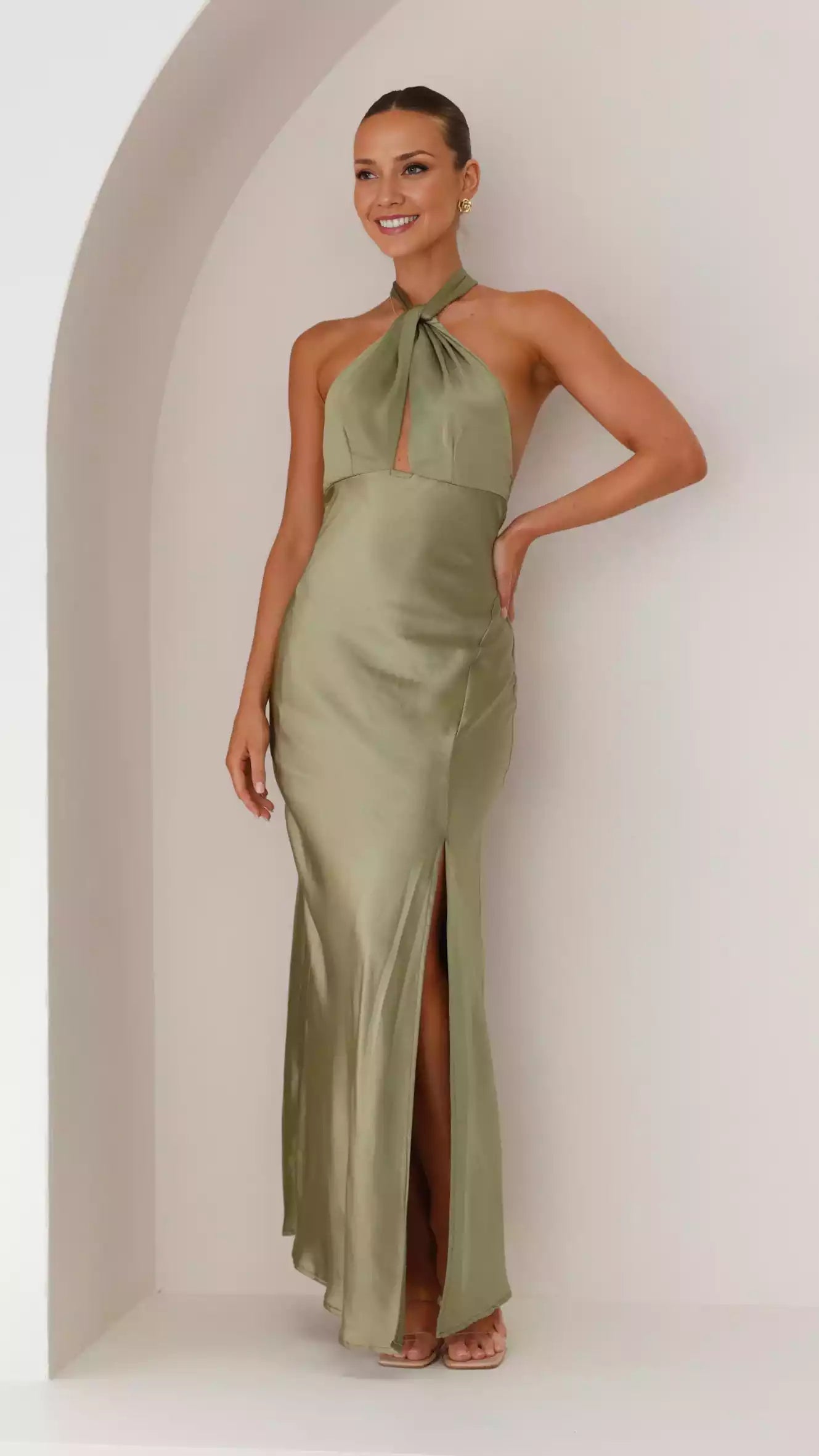 Stunning backless camisole with adjustable neck strap, side slit, hidden zipper at back for perfect evening look Prom Dresses