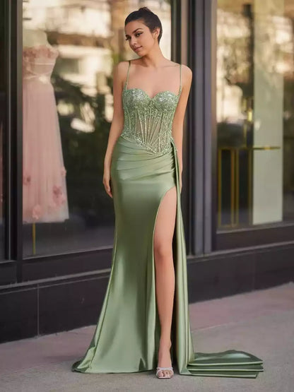 Stunning mermaid silhouette with excellent drape, sleeveless sequins, thin shoulder straps, and split Prom Dresses