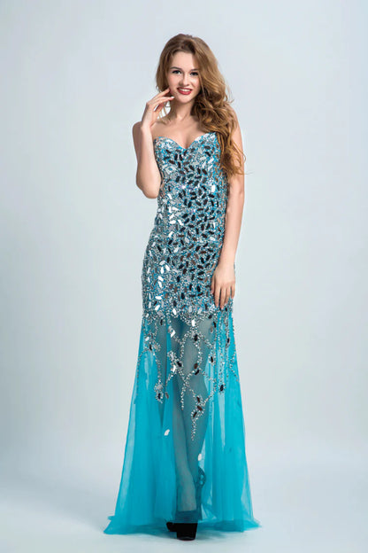 Sweetheart formal dress with beaded embellishments wrapped in sweeping tails