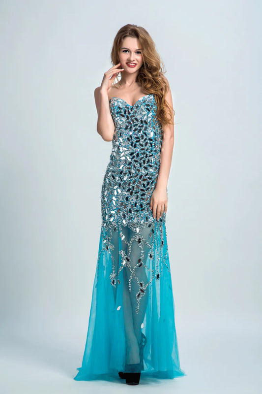 Sweetheart formal dress with beaded embellishments wrapped in sweeping tails