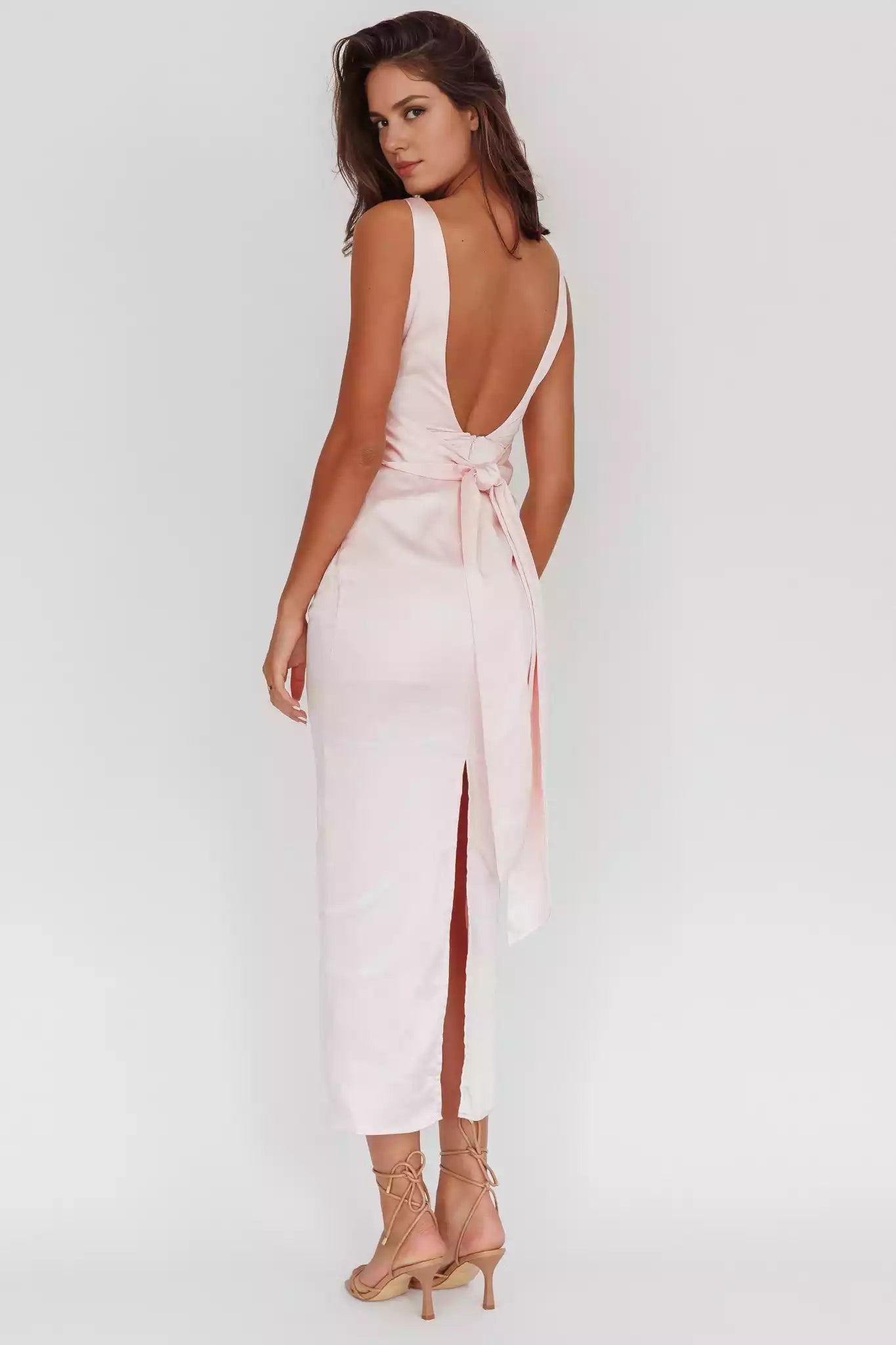 The eye-catching satin fabric features a slit at the back, a semi lined bow detail, and Bridesmaid Dresses