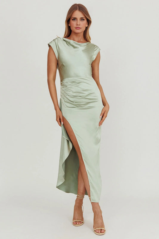 The eye-catching scarf with invisible side zipper and leg slits exudes a sense of drape, making it a perfect bridesmaid dress