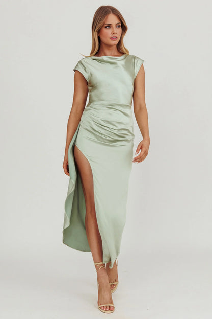 The eye-catching scarf with invisible side zipper and leg slits exudes a sense of drape, making it a perfect bridesmaid dress