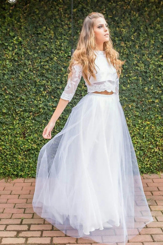Two piece set of beautiful ball dresses adorned with decals and floor sweeping lines, sheer gauze