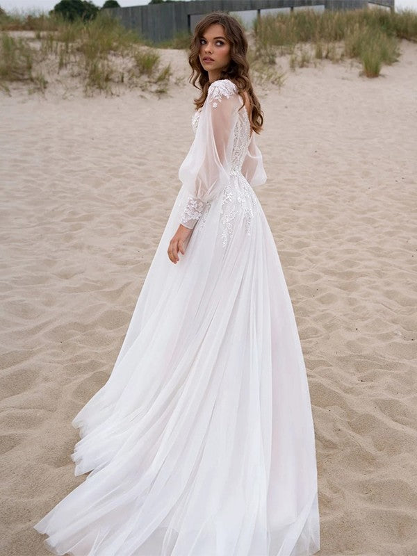 A-line princess style lace decal V-neck long sleeved large hem wedding dress