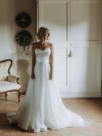 A-line Princess Organza Sweet Sleeveless Brush Train Wedding Dress with Ruffle Edge
